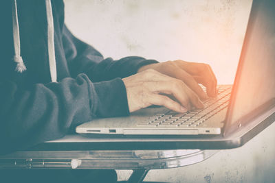 Man using laptop on table