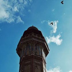 Low angle view of built structure against clear blue sky