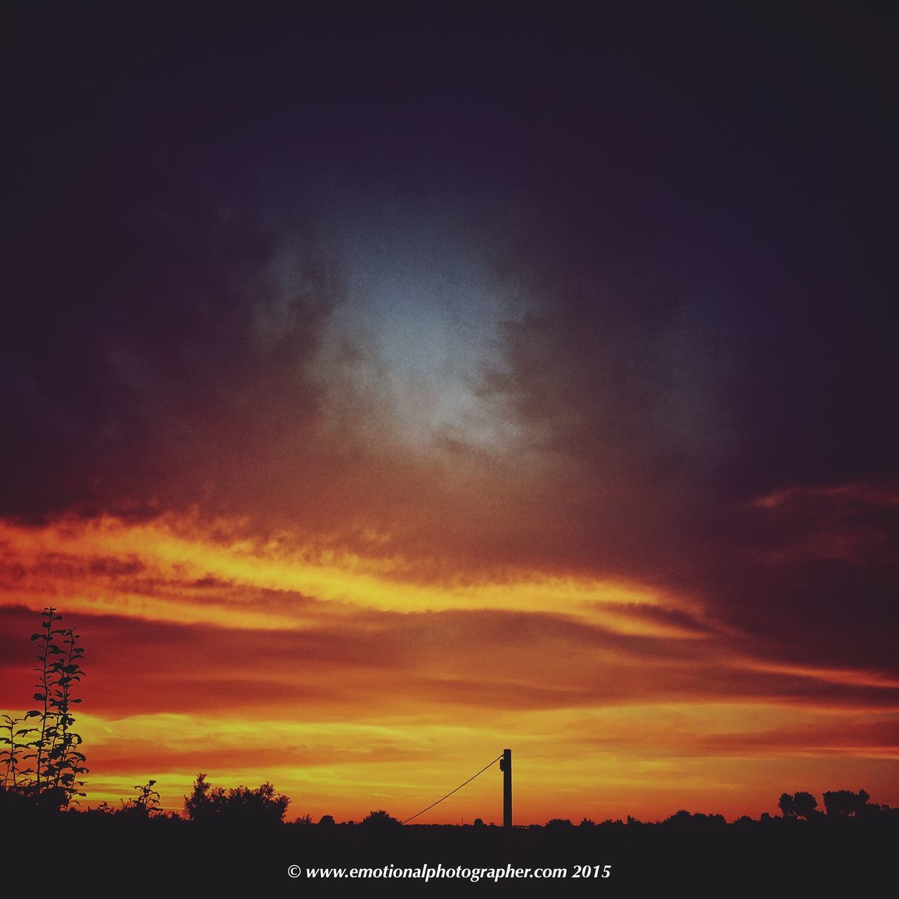 sunset, silhouette, sky, orange color, beauty in nature, scenics, cloud - sky, tranquility, tranquil scene, nature, low angle view, dramatic sky, built structure, tree, idyllic, architecture, outdoors, building exterior, cloud, dusk