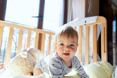 Portrait of cute girl sitting at home