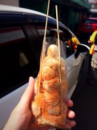 Close-up of cropped hand holding ice cream