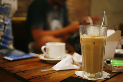 Glass of tea on table in cafe