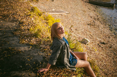 Woman sitting on road