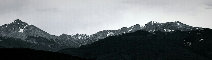 Scenic view of snow covered mountains against sky
