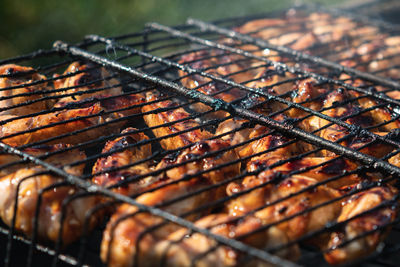 Close-up of meat on barbecue grill