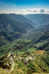 Misty mountain range covered with white mist and amazing blue sky