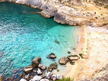 High angle view of rocks on shore