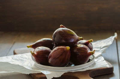 Close-up of fruits in plate on table