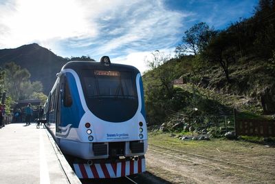 Train by road against sky