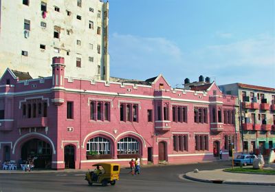 Street amidst buildings in city against sky