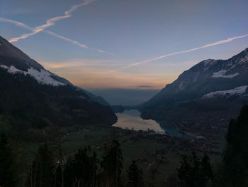 Scenic view of mountains against sky at sunset