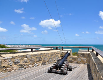 Cannon at round house against sky