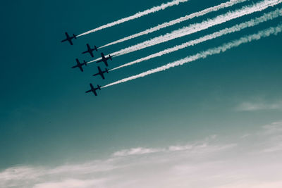 Low angle view of airplane against sky