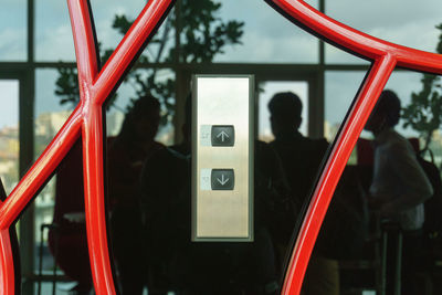 Close-up of elevator button with reflection