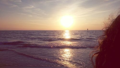 Scenic view of sea at sunset