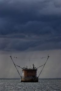 Ship in sea against sky