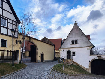 Exterior of houses and buildings against sky