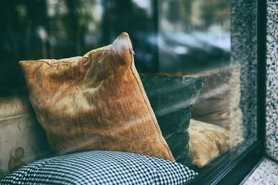 Close-up of pillows at the window