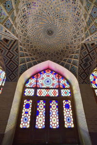 Low angle view of stained glass window of building