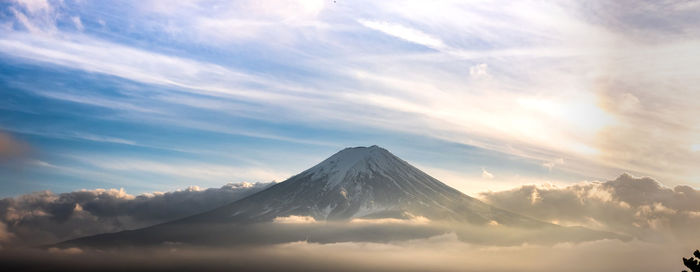 Scenic view of snowcapped mountain against sky