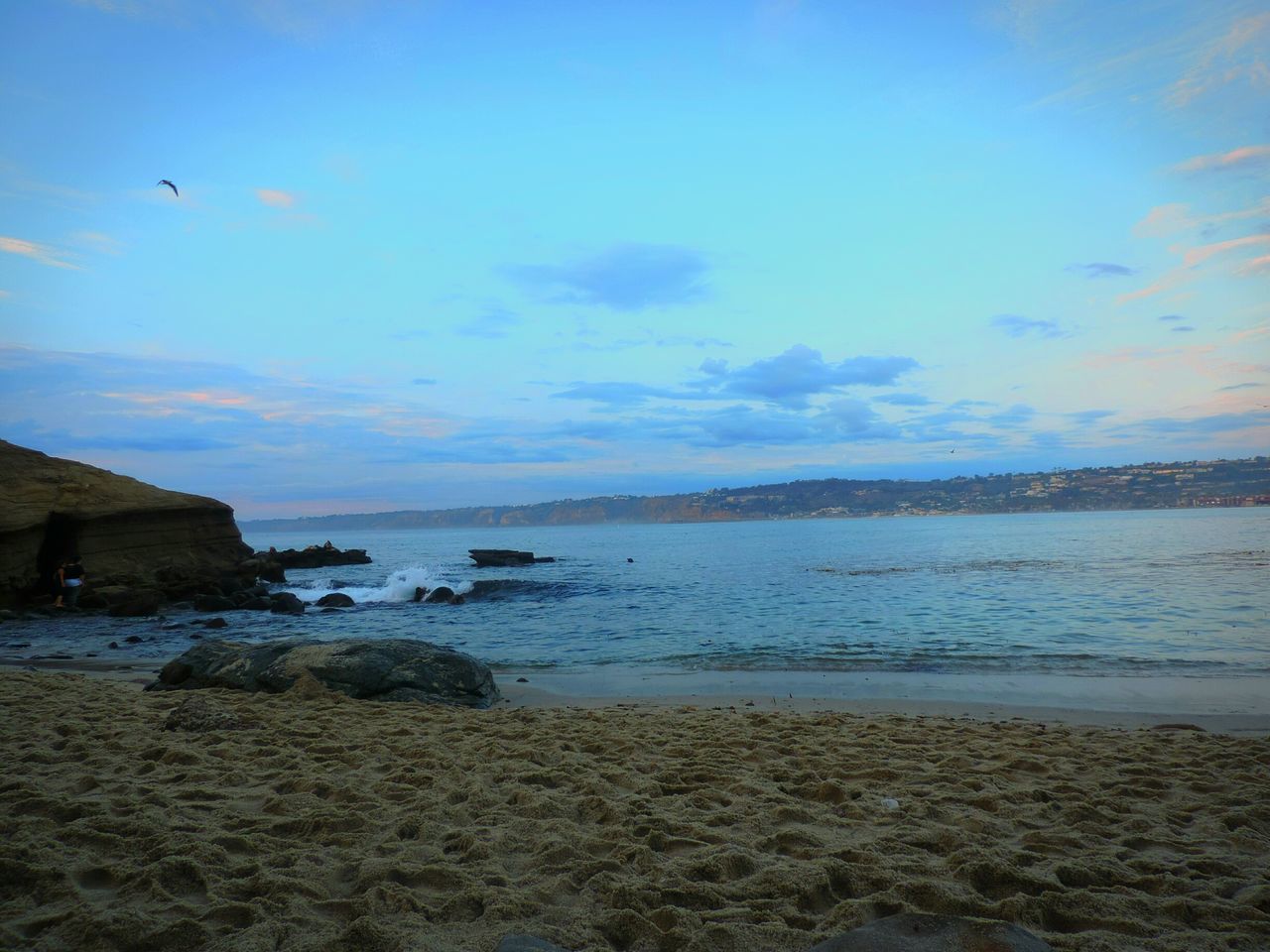 water, sea, beach, tranquil scene, shore, sky, scenics, tranquility, beauty in nature, sand, nature, horizon over water, blue, rock - object, idyllic, coastline, cloud - sky, calm, outdoors, remote