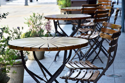Tables and chairs in a city street café