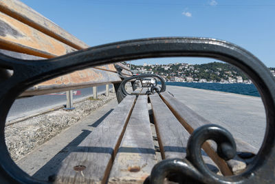 Close-up of bicycle wheel against clear blue sky