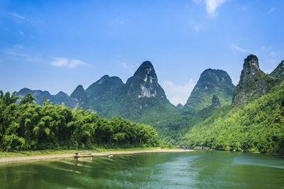 Scenic view of mountain against cloudy sky