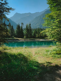 Scenic view of lake and mountains against sky