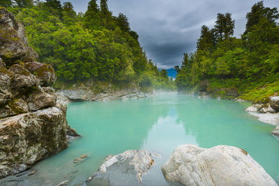 Scenic view of lake against rocks