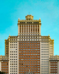 Low angle view of building against blue sky