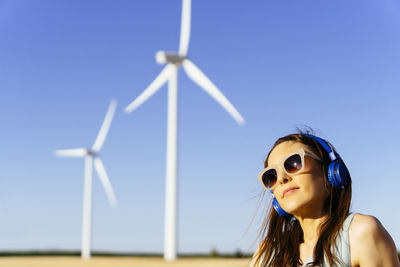 Low angle view of woman against sky