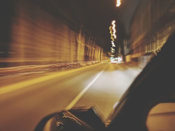 Illuminated car on road in city