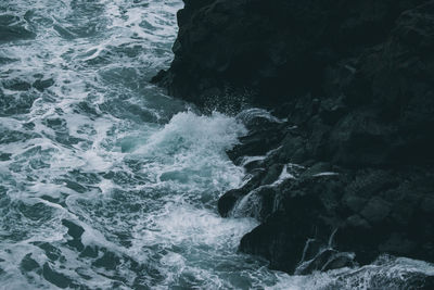 High angle view of rock formation in sea