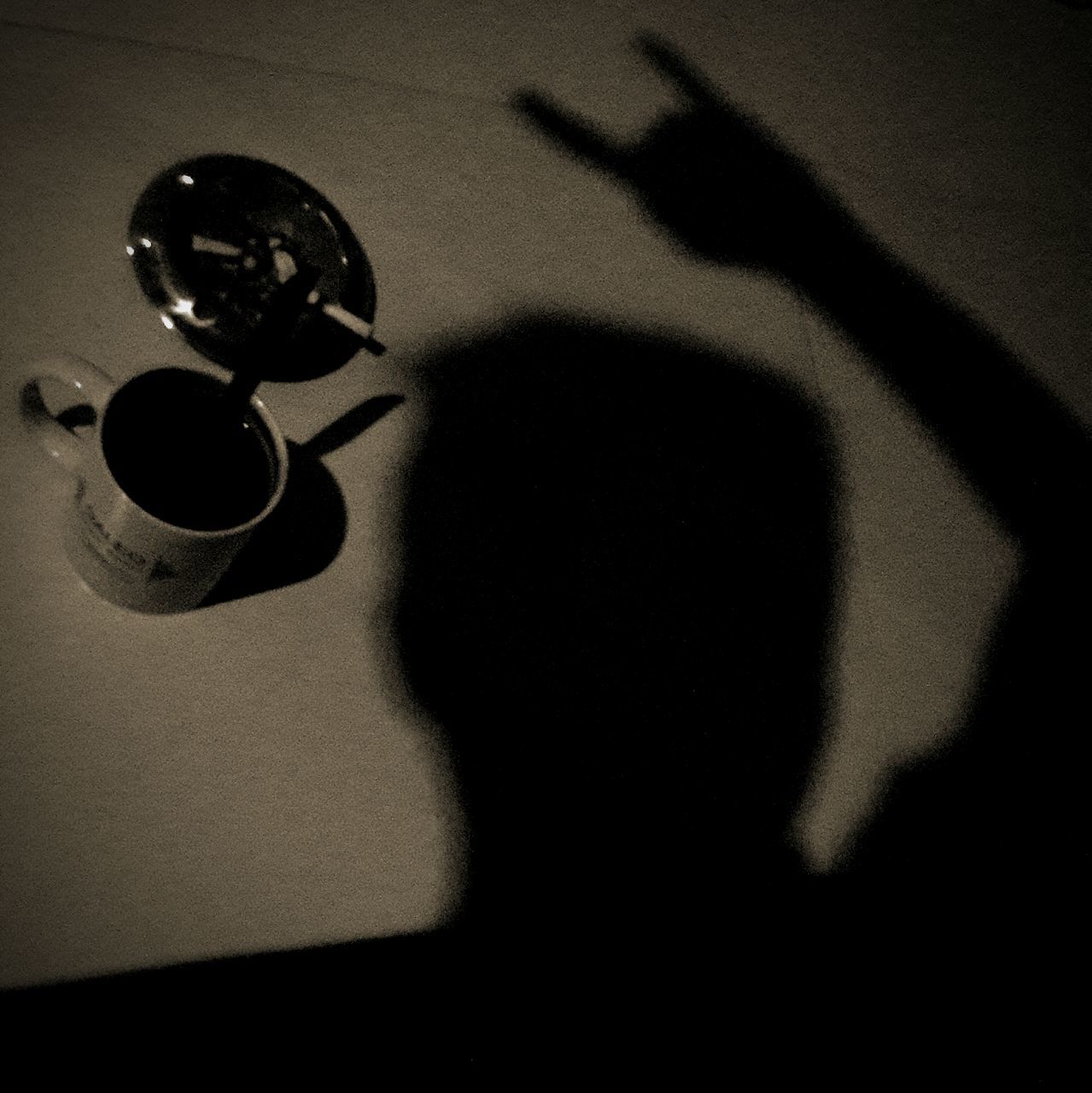 shadow, indoors, high angle view, still life, close-up, sunlight, table, lifestyles, leisure activity, focus on shadow, unrecognizable person, vignette, day, black color, selective focus, home interior, auto post production filter