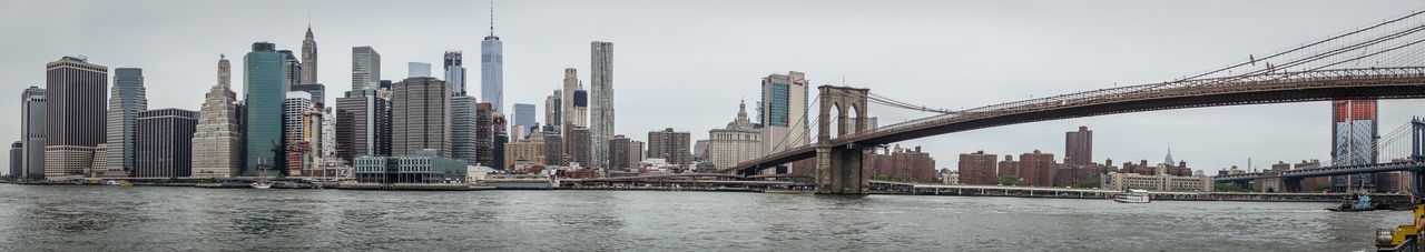 View of suspension bridge with city in background