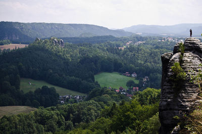 High angle view of trees and mountains against sky