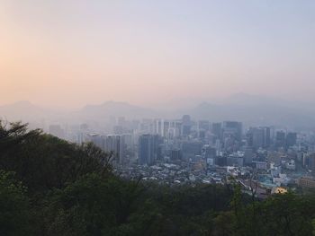 High angle view of buildings against sky during sunset