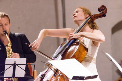 Woman standing at music concert