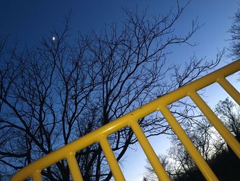 Low angle view of playground against clear sky