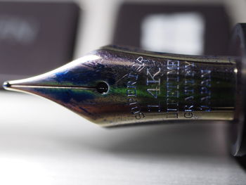 Close-up of pen on table