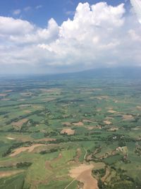 Aerial view of agricultural field against sky