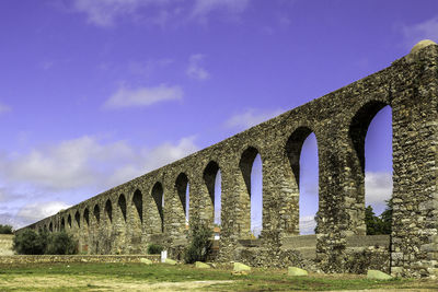 Low angle view of arch bridge against sky