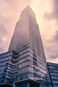 Low angle view of skyscraper against sky