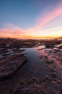 Scenic view of sea against sky during sunset