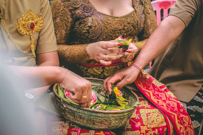 Midsection of woman holding ice cream