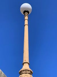 Low angle view of building against blue sky