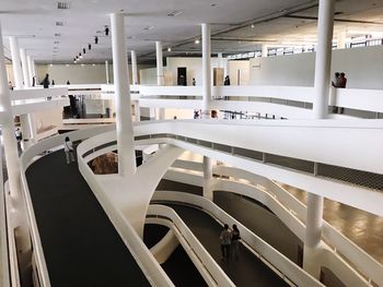 Empty chairs and tables in modern building
