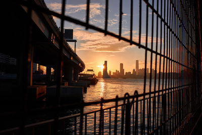 Buildings in city during sunset