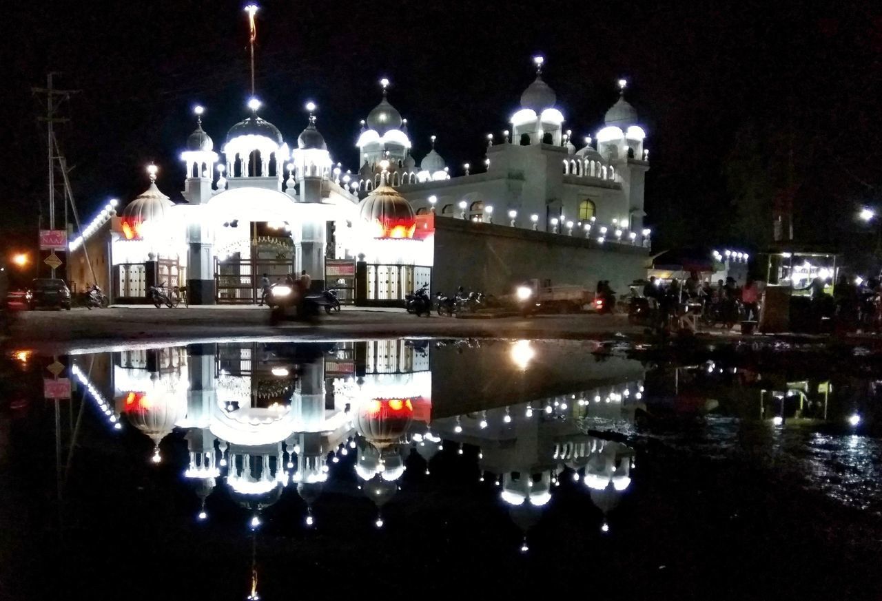 REFLECTION OF BUILDINGS IN WATER